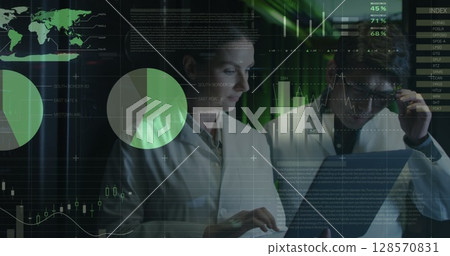 Image of data processing, diverse male and female it engineers with laptop by computer servers Image of data processing, diverse male and female it engineers with laptop by computer servers 128570831