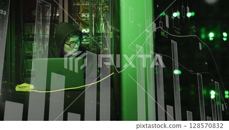 Image of statistics processing over asian male hacker in hoodie with laptop by computer servers Image of statistics processing over asian male hacker in hoodie with laptop by computer servers 128570832