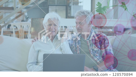 Image of network of connections over senior caucasian couple using laptop Image of network of connections over senior caucasian couple using laptop 128570894