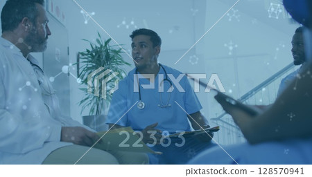 Image of numbers changing and molecules over male doctors 128570941