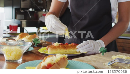 Image of broccoli over female food vendor preparing food for customer Image of broccoli over female food vendor preparing food for customer 128570986