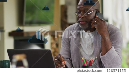 Image of clouds with arrows over african american man talking on smartphone Image of clouds with arrows over african american man talking on smartphone 128571155