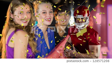 Image of falling confetti an american football player over woman Image of falling confetti an american football player over woman 128571208