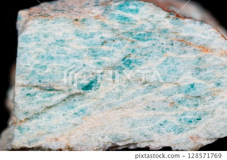 Macro mineral stone Amazonite on black background 128571769