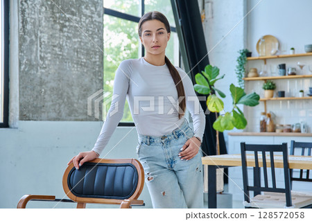 Portrait of beautiful stylish young teenage girl posing at home 128572058