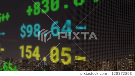 Composite image of stock market data processing against cityscape at night 128572898