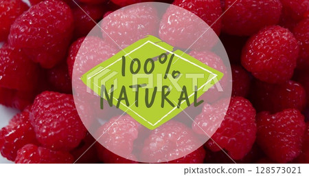 Image of 100 percent natural text over fresh raspberries in background 128573021