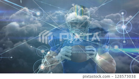 Image of clouds and network of connections over male american football player with ball Image of clouds and network of connections over male american football player with ball 128573038