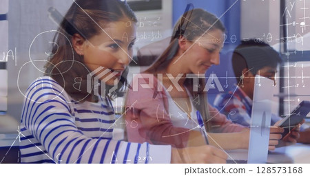 Image of mathematical equations over school children using laptop in classroom Image of mathematical equations over school children using laptop in classroom 128573168