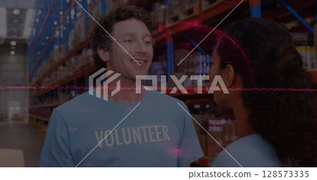 Image of financial data processing over diverse volunteers in warehouse 128573335