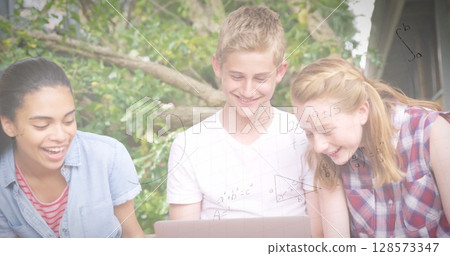 Image of mathematical equations over students using laptop 128573347