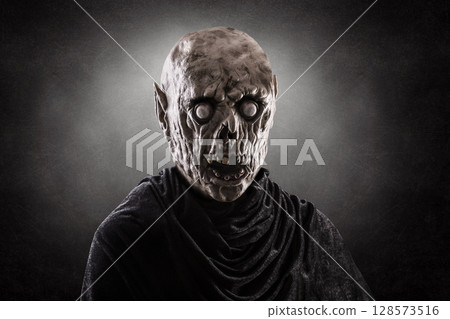 Portrait of a zombie over dark misty background Portrait of a zombie over dark misty background 128573516