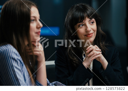 Senior female partner mentoring junior manager celebrating success and workplace solidarity Senior female partner mentoring junior manager celebrating success and workplace solidarity 128573822