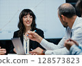 Happy female executive celebrating successful client deal and financial achievement closeup 128573823