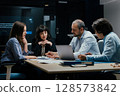 Modern office team meeting with presentation screen and professional executives brainstorming 128573842