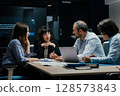 Modern office team meeting with presentation screen and professional executives brainstorming 128573843