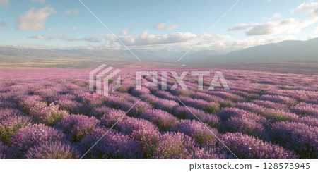 Immerse yourself in the vibrant beauty of a blooming lavender field, showcasing endless rows of purple under a bright blue sky, with a lone tree in the distance, evoking peace and natural splendor Immerse yourself in the vibrant beauty of a blooming lavender field, showcasing endless rows of purple under a bright blue sky, with a lone tree in the distance, evoking peace and natural splendor 128573945