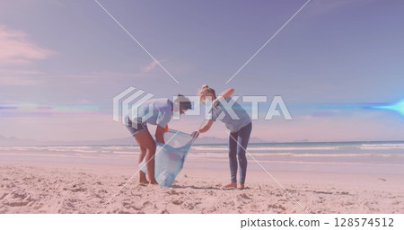Image of lights over diverse couple in face masks picking up rubbish from beach 128574512
