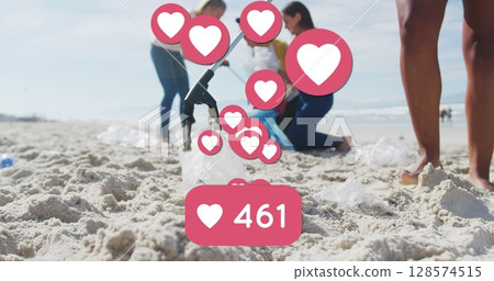 Image of social media heart icons over diverse volunteer group picking up rubbish from beach Image of social media heart icons over diverse volunteer group picking up rubbish from beach 128574515