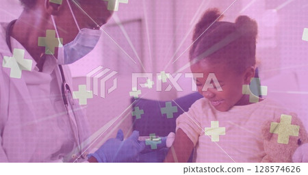 Multiple medical symbol floating against african american female doctor giving injection to a girl Multiple medical symbol floating against african american female doctor giving injection to a girl 128574626