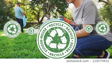 Image of recycling icons over smiling volunteers cleaning garden Image of recycling icons over smiling volunteers cleaning garden 128574652