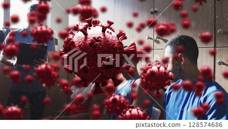Image of virus cells over diverse group of male football players with coach in changing room Image of virus cells over diverse group of male football players with coach in changing room 128574686