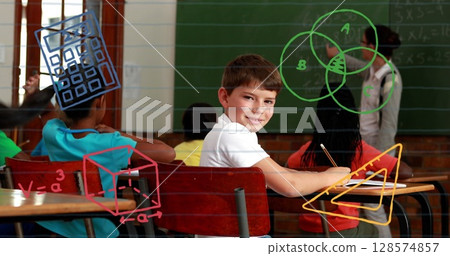 Image of school icons over caucasian schoolboy smiling in classroom with teacher and schoolmates 128574857