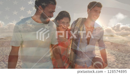 Image of flag of united states of america over happy diverse friends on beach Image of flag of united states of america over happy diverse friends on beach 128574895