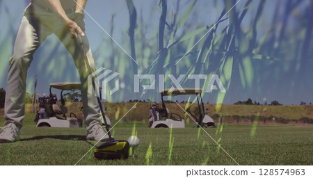 Image of grass over senior caucasian man playing golf on golf course Image of grass over senior caucasian man playing golf on golf course 128574963