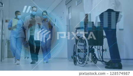 Image of scope scanning over diverse medical staff in face masks in hospital 128574987