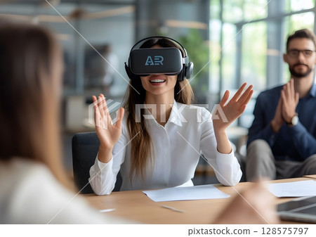 Manager conducting virtual AR training for new hires 128575797