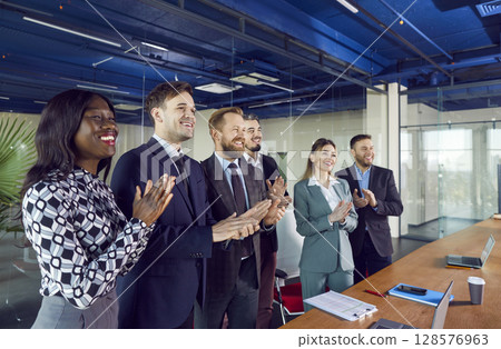 Happy friendly diverse employees applauding congratulating with business achievement, great result 128576963