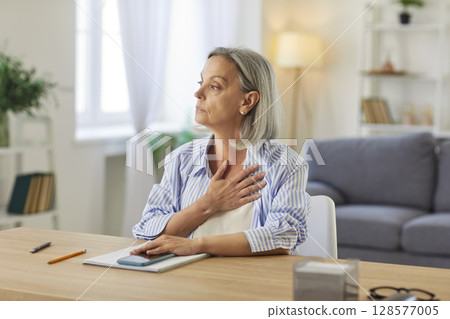 Thoughtful Senior Businesswoman Working In Home Office 128577005