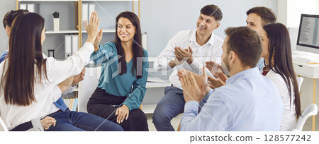 Positive Business People Applauding And Giving High Fives During Office Meeting 128577242