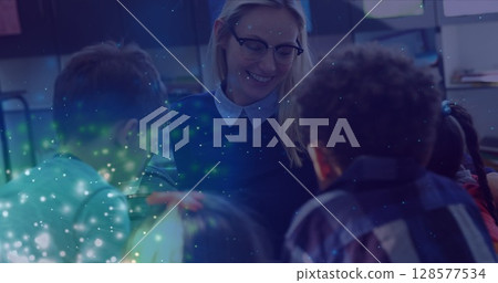 Image of light spots over happy caucasian female teacher diverse schoolchildren 128577534