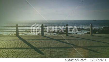 Image of light spots over biracial woman running on promenade 128577631