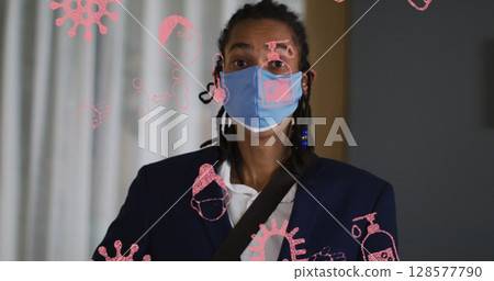 Image of pandemic icons over biracial man with face mask Image of pandemic icons over biracial man with face mask 128577790