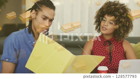 Image of sandwich icons over diverse business people talking Image of sandwich icons over diverse business people talking 128577793