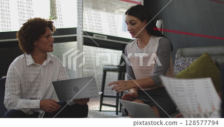 Image of data processing over diverse business people using laptop 128577794