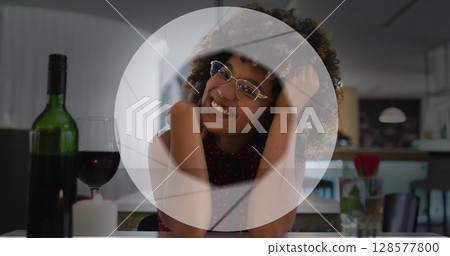 Image of circle over happy biracial woman with wine having image call Image of circle over happy biracial woman with wine having image call 128577800