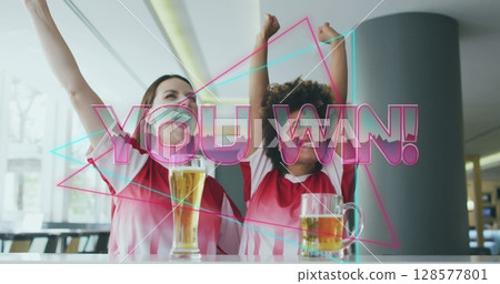 Image of you win text over happy diverse female friends raising hands and drinking beer 128577801