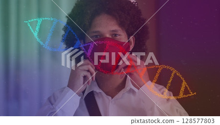Image of dna strand over caucasian man with face mask Image of dna strand over caucasian man with face mask 128577803