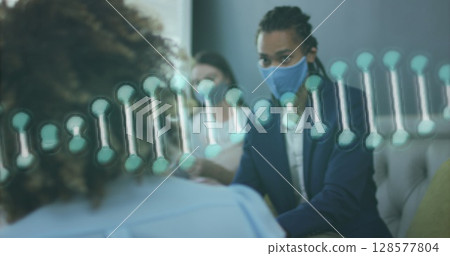 Image of dna strand over biracial businessman with face mask 128577804