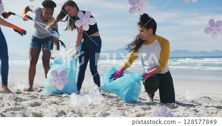 Image of flowers over diverse female and male volunteers picking up rubbish on beach 128577849