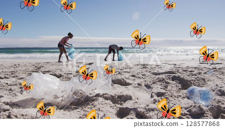 Image of butterflies over african american man and woman picking up rubbish on beach 128577868