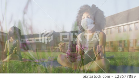 Image of flowers over diverse children with face masks practicing yoga and meditating Image of flowers over diverse children with face masks practicing yoga and meditating 128577889