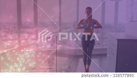 Image of light spots over caucasian woman practicing yoga and meditating Image of light spots over caucasian woman practicing yoga and meditating 128577893