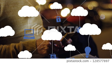 Image of clouds with electronic devices over caucasian man using smartphone Image of clouds with electronic devices over caucasian man using smartphone 128577897