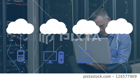Image of digital clouds with electronic devices over caucasian it technician with laptop 128577909