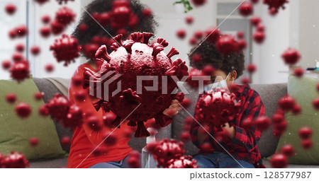 Image of virus cells over african american mother and son with face masks Image of virus cells over african american mother and son with face masks 128577987